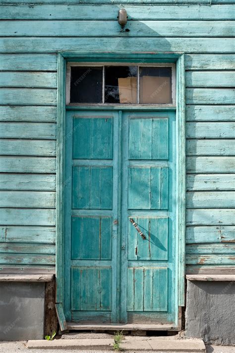 Premium Photo Old Turquoise Wooden Doors Entrance To Wooden House