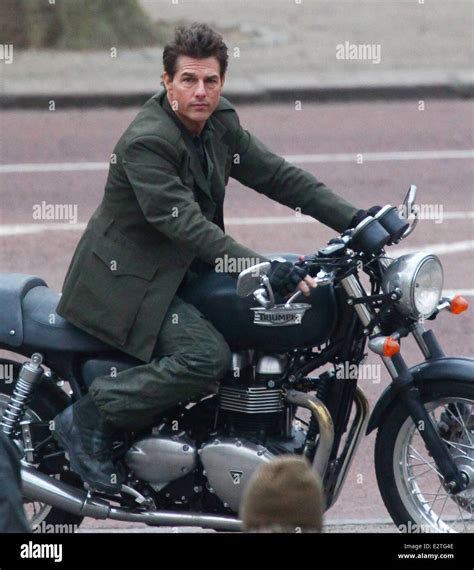 Tom Cruise Rides On A Triumph Motorbike Down The Mall While Filming A Scene From His Movie All