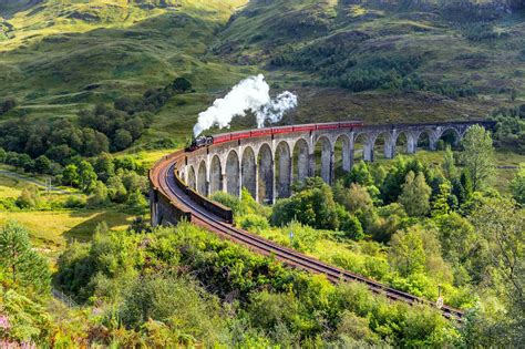 Uk Trains Through Scenic Seaside Towns And Mountain Peaks