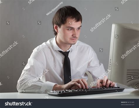 Young Man At The Computer Staring At The Monitor Stock Photo 94131445