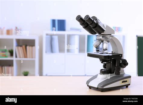 Microscope On Table In Chemistry Class Stock Photo Alamy