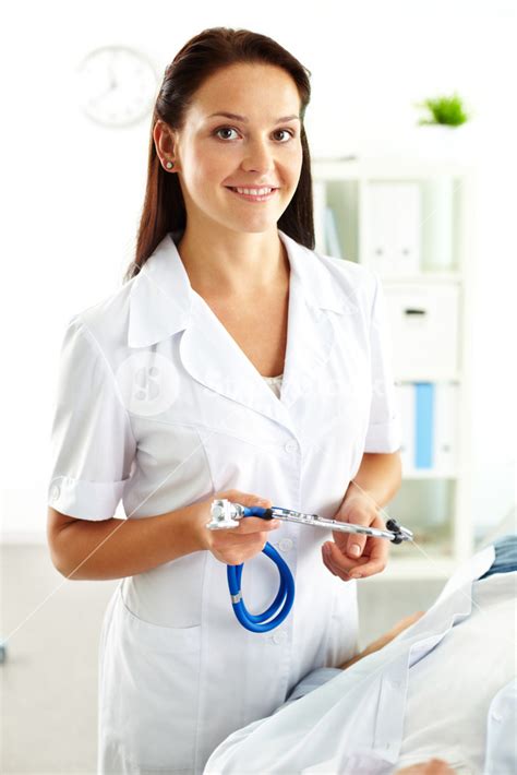 Portrait Of Confident Female Doctor With Stethoscope Looking At Camera
