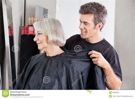 Hairdresser Removing Client S Apron After Haircut Stock Photo Image Of Looking Caucasian
