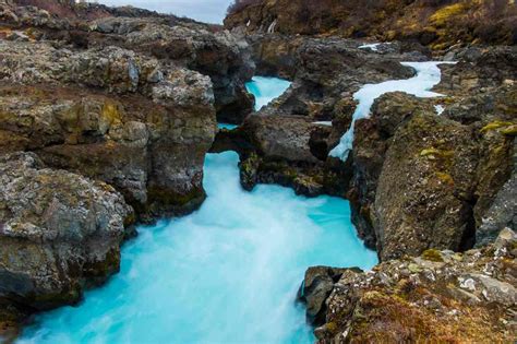 Unveiling Hraunfossar And Barnafoss Waterfalls Icelands Spectacular Duo