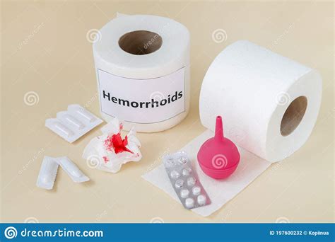 Hemorrhoids Treatment Concept Toilet Paper With Blood Next To Enema