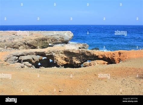 Natural Bridges Formation Of Coral Limestone On Aruba Island Coast