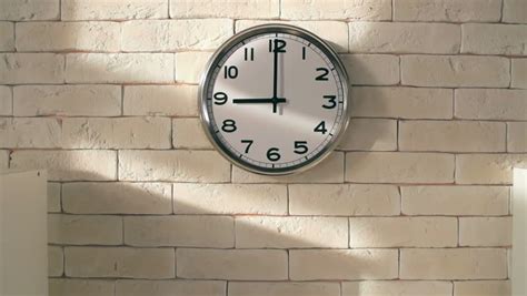(the) clock is ticking — the clock is ticking phrase used for saying that someone must do something quickly because there will soon be no more time left the clock is ticking on the peace talks. Zoom Out Of Electric Clock On White Brick Wall In Empty ...