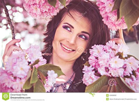 Pretty Woman With Branches Of Tree Blossoms Stock Photo Image Of