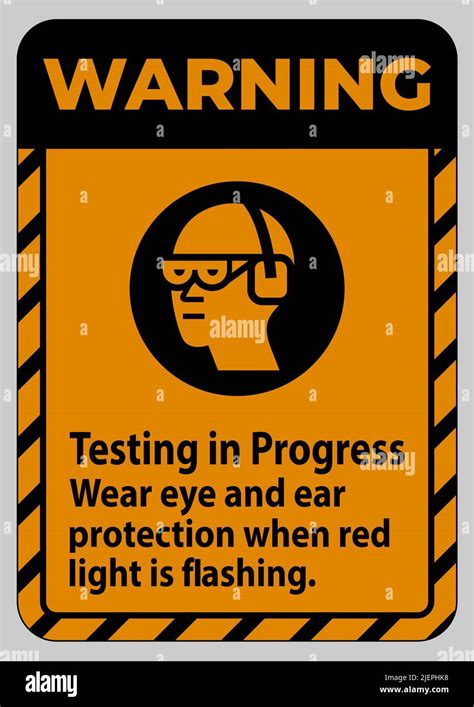 Warning Sign Testing In Progress Wear Eye And Ear Protection When Red Light Is Flashing Stock