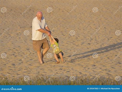Grandfather And Grandson Playing On Beach Stock Image Image Of