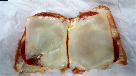 Open Faced Pepperoni Sandwich Topped With Muenster Cheese On French