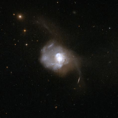 Hubble Finds That Nearest Quasar Is Powered By Binary Black Hole
