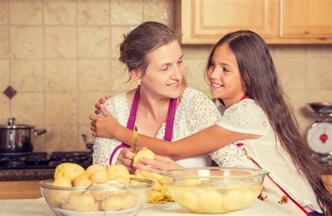 Happy Smiling Mother And Daughter Cooking Dinner Preparing Food Stock Image Image Of Care