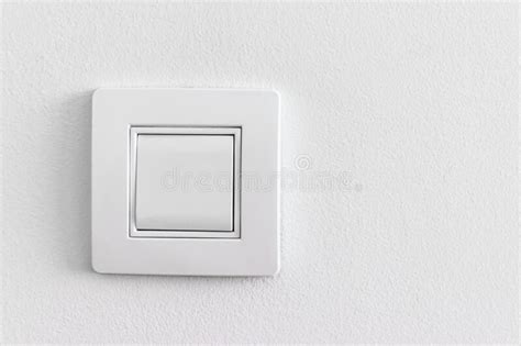 Single White Light Electric Switch On A Wall With Copy Space Stock