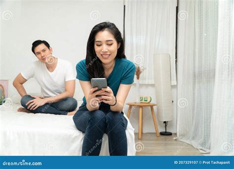 Asian Husband Feeling Suspicious Of My Wife`s Abnormality In Smartphone Use And His Wife Ignores