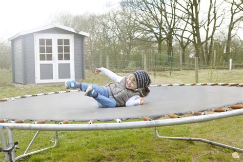 Boy Jumping On Trampoline Stock Photo Image Of Young 56031960