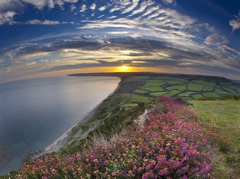 Sunset Over The Jurassic Coast Dorset England Wallpapers And Stock