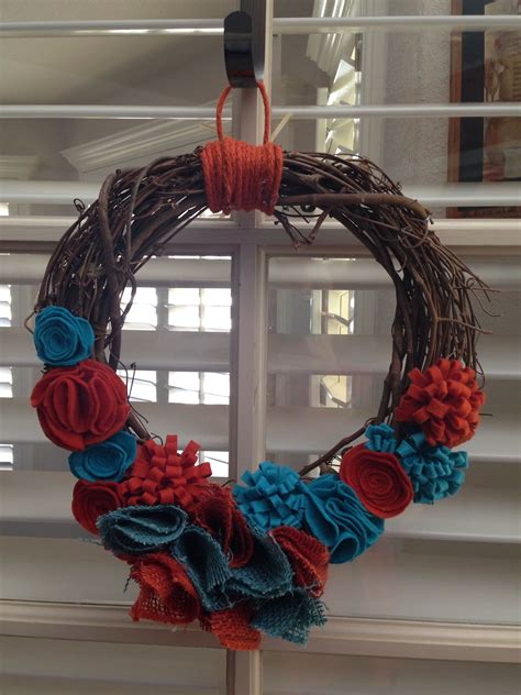 Located in west springfield, massachusetts. Grapevine wreath with some burlap and felt flowers ...