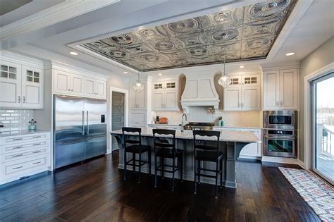 A tin ceiling is an architectural element, consisting of a ceiling finished with plates of tin with designs pressed into them, that was very popular in victorian buildings in north america in the late 19th and early 20th century. Traditional Kitchen with tin ceiling detail | Traditional ...