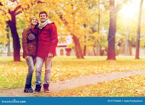 Happy Young Couple Walking In Autumn Park Stock Photo Image Of