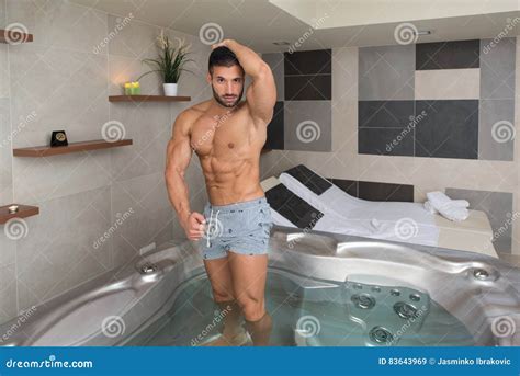 Man Flexing Muscles In Jacuzzi Spa Stock Image Image Of Happy