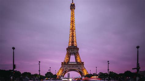 Eiffel Tower With Yellow Lights With Purple Sky Background Hd Travel