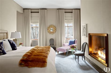 A Master Bedroom With Luxe Accents Including A Fox Fur Throw