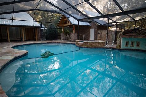 Swimming Pool With Waterfall Grotto Outdoor Kitchen Hot Tub And