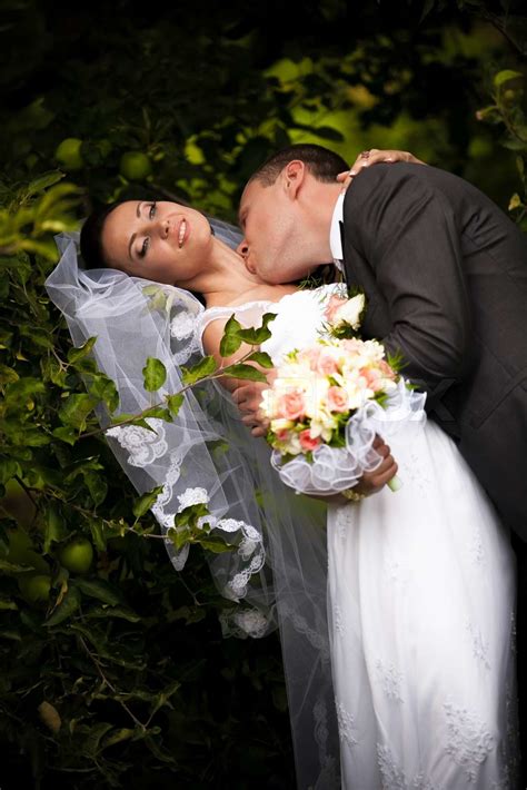 Groom Kissing Passionately Bride In Neck Neck Under Tree Stock Image