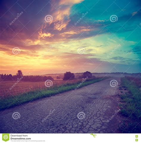 Landscape With Field And Country Road At Sunset Stock