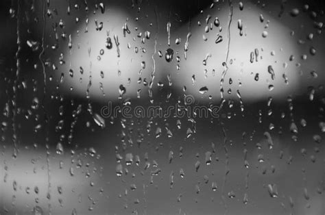Black And White Raindrops On Window Glass Stock Photo