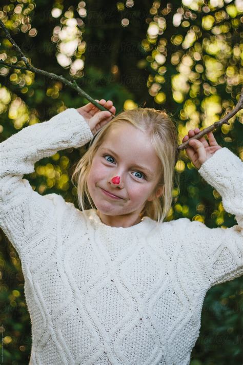 A Little Girl With A Red Nose And Pretend Antlers By Stocksy