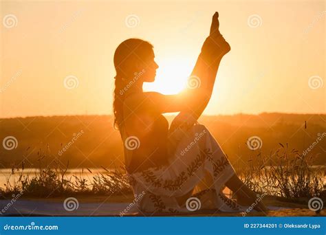 Female Silhouette Stretching At Warm Sun Light Stock Image Image Of