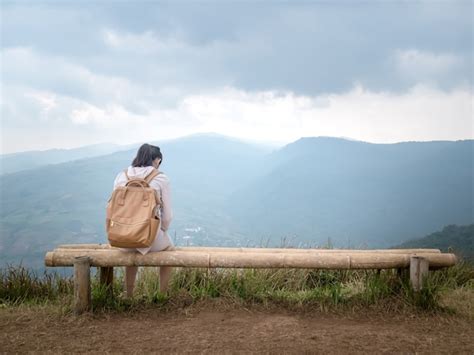 Premium Photo A Girl Sitting Alone And Shoulder Bag Brown On A Long