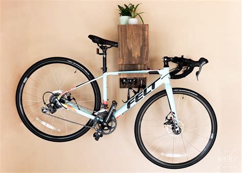 Diy wall bike hanger via doobybrain. DIY Wall Mounted Bike Rack - DIY Huntress