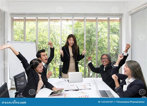 Group Of Happy Business People Cheering In Office Celebrate Success