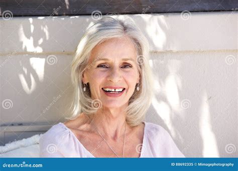 Beautiful Older Woman Smiling And Looking Confident Outside Stock Image
