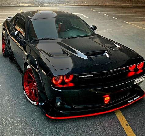Custom Black Sports Car With Red Rims