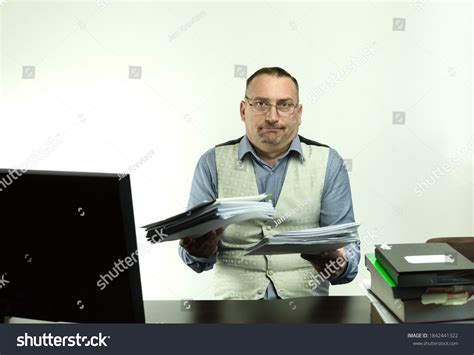 Male Office Worker Makes Helpless Gesture Stock Photo 1842441322