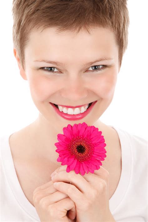 Smiling Woman With A Flower Free Stock Photo Public Domain Pictures
