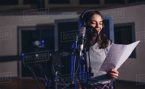 Smiling Female Singer With Microphone And Reading Lyrics Woman