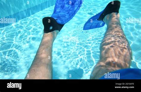 Swimming Male Legs In Blue Flippers Move Underwater In Blue Pool Stock Video Footage Alamy