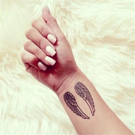 This area is small, so any wrist tattoo. 28 Elegant Angel Wings Tattoos On Wrists