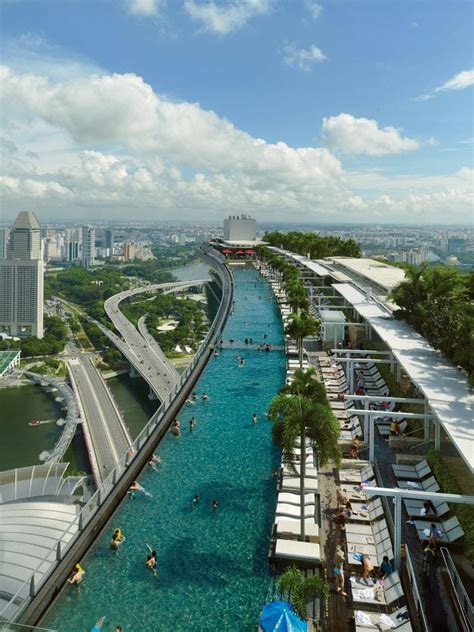 Towering over the bay, this iconic hotel offers the world's largest rooftop infinity pool, 20 dining. Pool on floor 57,Marina Bay Sands, Singapore....this is ...