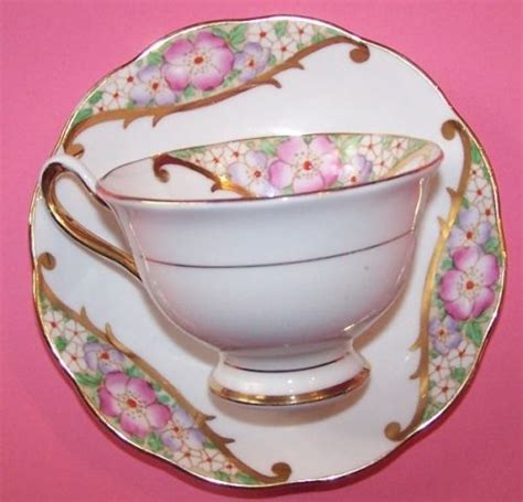 An antique teacup by royal albert with a cobalt blue & orange pattern. Royal Albert Crown China Footed Floral Cup and Saucer ...
