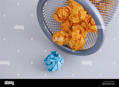 Crumpled Paper Balls Rolling Out Of A Trash Can Close Up Stock Photo