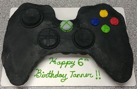 A Birthday Cake Made To Look Like A Video Game Controller