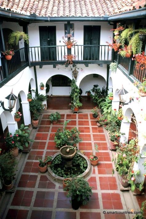Spanish house plans capture the essence of mediterranean spain and incorporate the rich moorish, byzantine, gothic, and renaissance styles. Two story courtyard with Spanish tiles and archways ...
