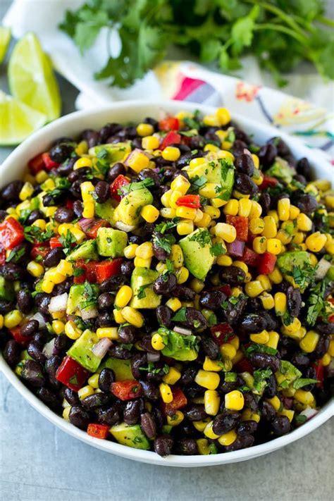 A Serving Bowl Of Black Bean Salad With Corn Peppers And Avocado