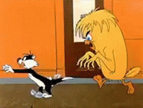 Two Cartoon Characters Are Fighting In Front Of An Orange Building And